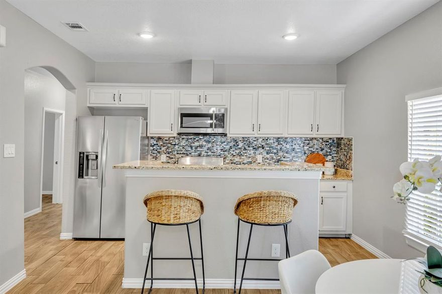 This recently updated 1920's home plus guest quarters is located in the much desired Sunset Hill neighborhood, just minutes from all that Bishop Arts, Trinity Groves, & Downtown Dallas has to offer! In the main residence, complete with 3bds & 1 full bath, you will find an open floor plan including a spacious living & dining area overlooking the kitchen, complete with granite countertops, newer backsplash, & stainless steel appliances. All three bedrooms are amply-sized & the bathroom has been fully updated. Wood-look tile, ceiling fans, & custom wood trim throughout the home. Backyard includes updated 700sqft bonus quarters with a full kitchen, 2 bedrooms, Living Space, Full bathroom & W-D closet. The driveway has an entrance in the front & back, perfect for tenant privacy. Wonderful opportunity for Investors looking for an income producing property!