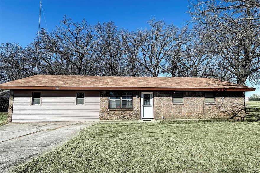 Well-Maintained Home on large corner lot in Established Neighborhood with mature trees!!  Located just outside of town in a quiet neighborhood with mature trees, this property offers both charm and convenience. Situated on a spacious corner lot, the home features two living areas for flexible use and an updated kitchen with modern finishes. The established setting provides a peaceful atmosphere entirely fenced with oversized lot, while still being less than one minute from Highway 59 and 2 miles from shopping, and schools. With its excellent location and move-in ready condition, this home is an ideal choice for comfortable everyday living.This home offers two living spaces well suited for a growing family.