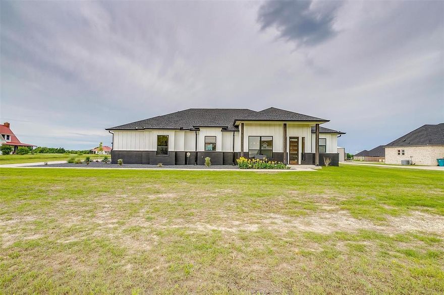 Versatile 3-Bedroom Home with Fully Outfitted Shop & Modern Upgrades on 1 Acre. Welcome to your new, spacious and thoughtfully upgraded 3-bedroom, 2.5-bathroom home offering 2,608 sqft of comfortable living space on a beautifully maintained 1-acre lot. This property is ideal for those seeking space, functionality and the freedom to live and work in one place. The clean, immaculately maintained main home features a smart and inviting layout, with a large open living area, generous kitchen and a private primary suite with ensuite bath and walk-in closet. The home is pre-wired for holiday lighting with a timer system and Jacuzzi hook-up on the back patio.  The extended back patio is perfect for entertaining or relaxing outdoors looking out over your 1 acre lot that has a 12-station irrigation system to keep it plush and beautiful. The impressive, large, 32x40 detached shop is a standout feature - fully insulated with 1” closed-cell insulation throughout the main area and 1” closed-cell plus 4” open-cell insulation in the living quarters. Both sides of the shop are fully climate controlled, making it perfect for a workshop, studio, guest living, or potential rental space. (Upgraded Features Include: Separate 200 amp service (400 amp total with house); 50 amp generator plug with main lockout; 30 amp RV plug; Extended pad with sidewalk access; and Mesh Wi-Fi system convey with property provides coverage across the entire property.) This stunning estate combines the freedom of rural living with modern upgrades and exceptional flexibility. Whether you need a multi-use workspace, extra living quarters, or just a home with room to grow and entertain - this one checks all the boxes.