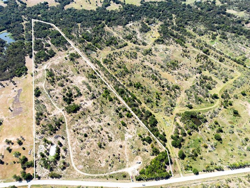 Approximately 46 acres offered for sale to create your dream ranchette! Just outside the City of Corsicana in Mildred ISD, you're just a short drive to Richland Chambers Reservoir. There's a small pond on the property and a creek that runs through the back acreage. M.E.N water available across the road. Ag exempt.