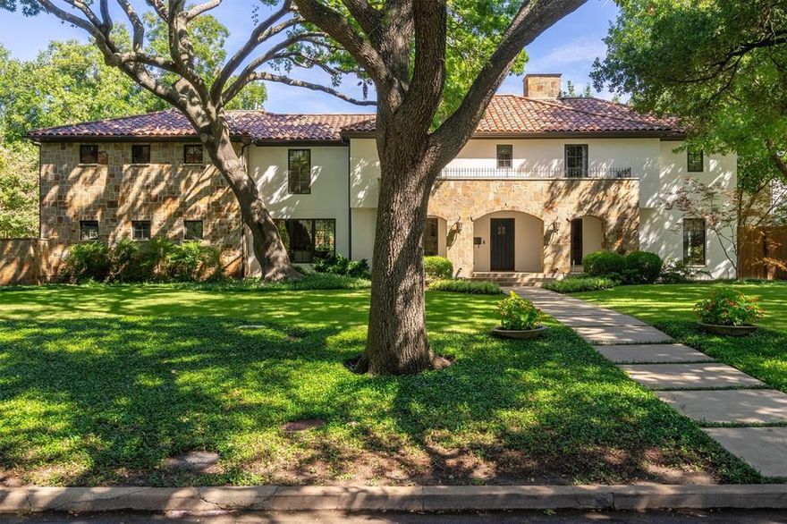 Imagine a sunlit Tuscan Villa in the heart of Dallas, on over half an acre of lush grounds with expansive gardens, terraces, verandas, a gazebo, diving pool, cabana & glass walled greenhouse. Just extensively renovated, luxury is at every turn. A grand foyer welcomes you leading to a lovely living room with handsome stone fireplace, a charming private study, spacious sunlit guest suite and luxurious bath, all accessing the arched veranda. Stunning dramatic kitchen with dove gray color scheme quartz counters, 400 bottle glass door wine closet. Gracious dining room and cozy family area are adjacent to the kitchen and access veranda and pool. Upstairs features elegant primary suite, study, two guest suites with shared bath all have access to a deep open balcony. Exquisite new apartment features kitchen, game room, bedroom-bath and enormous utility room with extensive custom storage cabinets. This magnificent property beckons a loving new family.