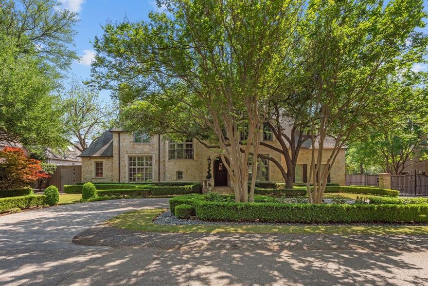 Exquisite French Mediterranean-style home, with a circular drive, featuring an electrical gate entry to garage. Hand scraped hardwood floors, two stairways with wood landings, custom cabinetry, plantation shutters, curved iron stairway, the details are impeccable. The kitchen is equipped with Sub Zero and Wolf appliances, a large island, double ovens, and butlers pantry. There is also a refrigerated wine cellar that holds 500+ bottles, a media room, library, the primary suite features a spa inspired bathroom with heated floors, a gilded groin vault ceiling, and a white solid marble tub.
The outdoor living space includes a stone fireplace, outdoor kitchen with with a built-in gas grill, fridge, ice maker, with pristine landscaping and a zoysia grass upgrade, a seating area with a fire pit, a newly replastered pool and spa, with deck jets and fountains. 
Extra features include a tankless water heater, covered veranda on the side of house for pool equipment, wired for a Lutron system, and security system. Front yard and backyard landscape lighting as well.
Award winning builder, Allen Nixon, and architect CA Nelson.