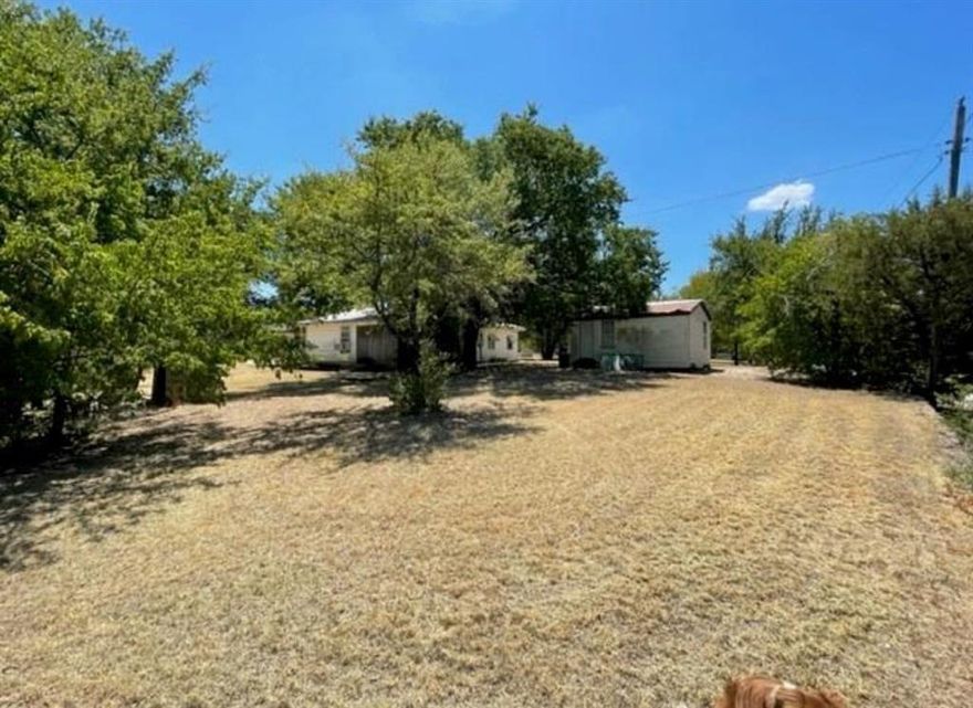 CALLING ALL CAR ENTHUSIAST or MACHINIST!!! This property Offers a Man's dream garage and workshop with lake views. You are only one lot from the lake, and the property consist of multiple lots. Seller has additional surrounding lots available from $1000-$2300. This property also offers a small cabin like structure with electric ran to it. Great lot, with a lot of potential. Bring all the cars or toys you can handle and keep them under covered parking or put them in a garage- you have plenty of space for all of it. The main house is in some need of minor updating and repairs, and the cabin would need a new ceiling, and floors. Overall great property with tons of potential for a lake cabin or a rental. COME AND CHECK IT OUT. Square footage of main house is an estimate and has not been confirmed.