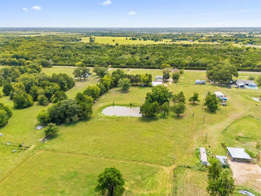GREAT INVESTMENT OPPORTUNITY WITH 3 SEPARATE HOMES ON 5 ACRES! Discover a rare multi-home property offering endless potential on 5 acres in Wills Point. This unique setup includes three separate homes—each with its own character and function—perfect for multi-generational living, guest accommodations, or income-producing rentals. The main home at 1970 Van Zandt County Road 3810 spans approximately 1,507 sqft, featuring a spacious layout with a sunroom, large front patio, and mature trees that create a peaceful country setting. The second home at 1972 Van Zandt County Road 3810 is a 528 sqft studio that sits adjacent to a large metal workshop, offering an ideal setup for guests, storage, or hobby use. The third residence at 1930 Van Zandt County Road 3810 is a 1,680 sqft manufactured home with its own covered porch and open yard space, providing excellent flexibility for additional living or rental income. Multiple outbuildings and open acreage allow room for livestock, gardening, or outdoor recreation. Conveniently located with quick access to Highway 80 and I-20, this property combines peaceful country living with practical versatility—an exceptional opportunity for investors, families, or those seeking a private homestead in Van Zandt County. Just minutes from downtown Wills Point, local schools, and Lake Tawakoni, residents can enjoy both small-town charm and easy access to nearby shopping, dining, and outdoor recreation.