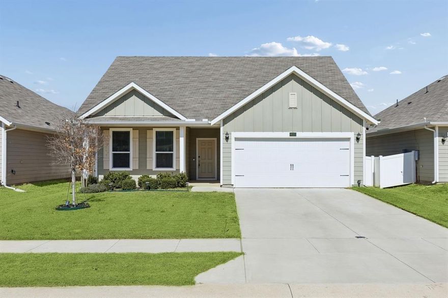 This 3-bedroom, 2-bath home offers clean lines, modern finishes, and an easy layout that works beautifully for everyday life. The open-concept design creates a natural gathering space, with durable wood-look flooring running through the main areas and bringing everything together. The kitchen is the centerpiece — oversized island, light cabinetry, sleek hardware, granite counters, and stainless appliances. It’s functional without sacrificing style, and there’s plenty of space to cook, host, or simply spread out. The primary suite is tucked away for privacy and offers a spacious bedroom and well-appointed bath designed for both comfort and convenience. Secondary bedrooms are thoughtfully positioned and versatile enough for guests, kids, or a dedicated office. Step outside and you’ll appreciate the covered outdoor space — ideal for relaxing at the end of the day or entertaining on weekends. Living in Providence Village means access to community amenities, walking paths, green space, and that neighborhood feel people are always hoping to find. It’s a well-established master-planned community where lifestyle matters.