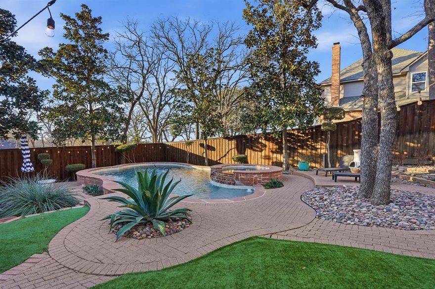 Located in the prestigious Williamsburg Estates, this one-of-a kind property showcases exceptional attention to quality and modern living. This home sits on a lush .386-acre lot and offers 2966 square feet of luxury living, showcased by unparalleled comfort and designer touches.  Wonderfully maintained, this open concept home has undergone impressive renovations and upgrades. The functional floor plan boasts two dining areas, a chef-inspired kitchen, two living rooms, four bedrooms, three remodeled bathrooms, and a utility area. The flexible floor plan easily allows one of the bedrooms to serve as a dedicated study. The private backyard is a serene getaway with an extensive patio overlooking a play pool with new Pebble Tec finish surrounded by premium turf and a beautiful pergola for outside dining and entertaining. Inside, the home feels warm and welcoming with Travertine and solid wood floors, gracious windows, designer fixtures, custom millwork, new exterior and interior lighting and wrought iron spindles on an impressive staircase . The gourmet kitchen is outfitted with stately concrete counters, top-of-the-line Viking Professional appliances including an 8-burner gas range, upgraded cabinetry and a charming breakfast nook before windows with French doors leading to a side patio. Located away from the traffic areas of the home, the primary suite is a peaceful escape with lovely windows, wood floors and a spacious remodeled bathroom. This home is more than just a place to live, it's a lifestyle. Whether you're entertaining guests, enjoying a peaceful pool day, or relaxing indoors, this home offers an unmatched blend of a functional floor plan, custom upgrades and designer touches throughout every room. This home feeds the award-winning Keller ISD and is located a short commute to DFW International Airport, local eateries and upscale shopping.