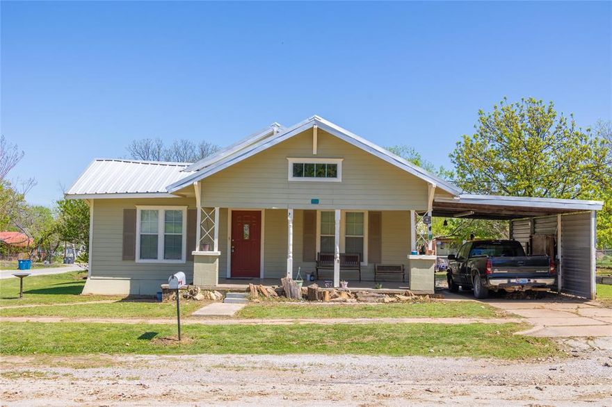 Nicely remodeled 3-1 frame home that is move in ready!  Central air-heat, updated wiring and plumbing, new windows, flooring, paint and metal roof are just a few of the features that make this home attractive and ready for new owners!  Includes a large, comfortable front sitting porch, a single car attached carport, a detached 1 car garage and storage building, and then the 2012 built 20'x20' all metal shop with concrete floor.  Located on a spacious 100'x120' corner lot, with a nice chicken coop and outbuildings.  Ready to move in and start living, give us a call to see this one!