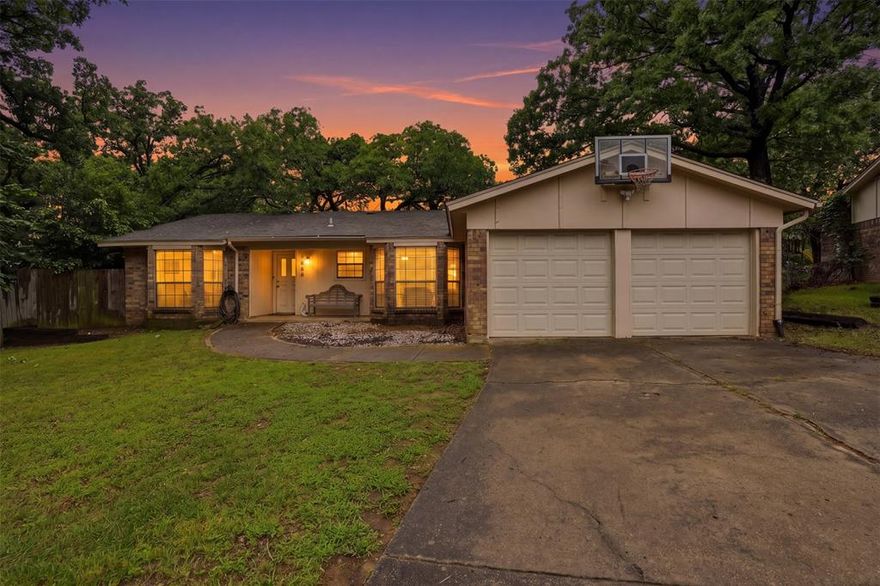 Discover this charming single-story home tucked on a quiet cul-de-sac, offering a bright open-concept layout and a spacious, fully fenced backyard ready for entertaining. The kitchen and bathrooms feature granite countertops, while durable laminate flooring, recessed lighting, and French doors create a modern, low-maintenance interior. A wood-burning fireplace anchors the living room for cozy evenings at home. Outside, enjoy a 12-foot covered patio for outdoor dining and relaxation, plus abundant yard space ideal for gardening, a playset, or future additions such as a pool or outdoor kitchen. Mature landscaping and a private setting make the yard an extension of the home. Parking is easy on this cul-de-sac with an extra-long driveway and street parking just outside the front door. Conveniently located about 1 mile from I-30 and I-820, with easy access to Downtown Fort Worth, Arlington, and Dallas make commuting easy.  You’ll also be close to restaurants, shopping, parks, and schools. Perfect for first-time buyer, or anyone seeking a comfortable turnkey home in a desirable neighborhood. Don’t miss this one—schedule a showing today.
