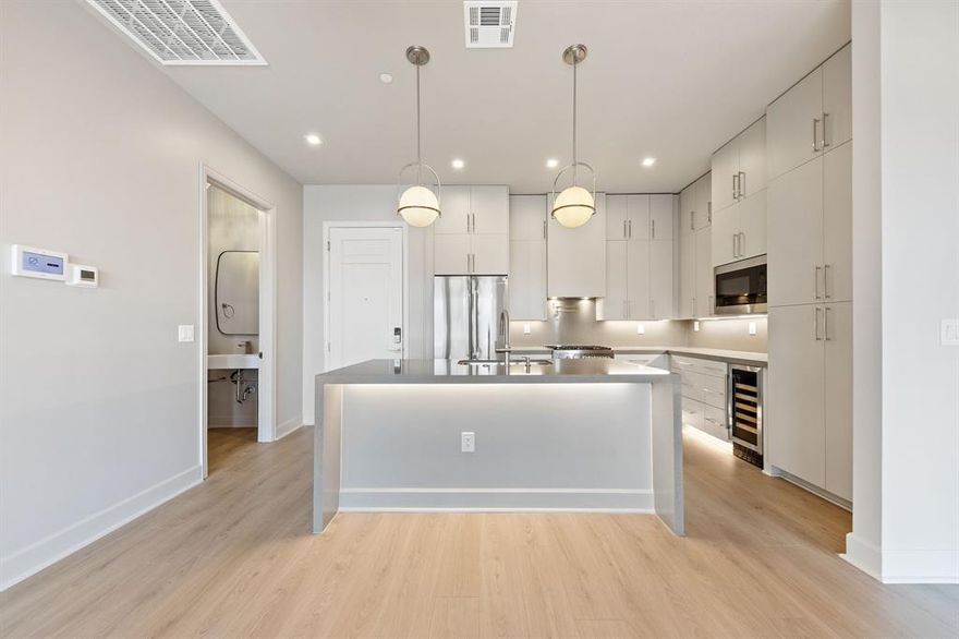 *Ask about Buyer Incentives, including a 2-1 buydown with the Preferred Lender!*

Welcome to Unit 508 at 1900 S Ervay “The Ruston,” a newly completed new-construction residence offering panoramic Downtown Dallas skyline views and refined modern living on the edge of the city’s urban core. This exclusive condominium building sets the standard for sophisticated living, combining striking architecture with world-class amenities in the heart of the vibrant Cedars neighborhood, just minutes from premier dining, shopping, entertainment, and cultural attractions. This architectural masterpiece features 58 luxury condominium residences, each meticulously crafted with premium materials and thoughtful design Residents enjoy access to a full suite of resort-style amenities, including a community reflection pool, state-of-the-art fitness center, media room, wine room, game room, clubhouse, conference room, dog run with dog-washing station, pickleball court, putting green, and an outdoor lounge with grilling areas, ideal for entertaining or unwinding in style. 

Unit 508 offers 1,302 square feet, featuring 2 bedrooms and 2.5 bathrooms, with expansive windows and a private balcony that frame breathtaking city views and flood the home with natural light. The open-concept interior showcases high ceilings, designer fixtures, and upscale finishes, highlighted by a chef’s kitchen with a 6-burner Bertazzoni gas range, Bosch refrigerator, wine cooler, pot filler, under-cabinet lighting, and soft-close cabinetry. Built-in surround sound speakers, an electric fireplace, enhance both comfort and functionality.