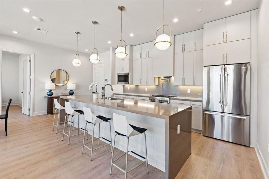 *Ask about Buyer Incentives, including a 2-1 buydown with the Preferred Lender!*

Welcome to Unit 508 at 1900 S Ervay “The Ruston,” a newly completed new-construction residence offering panoramic Downtown Dallas skyline views and refined modern living on the edge of the city’s urban core. This exclusive condominium building sets the standard for sophisticated living, combining striking architecture with world-class amenities in the heart of the vibrant Cedars neighborhood, just minutes from premier dining, shopping, entertainment, and cultural attractions. This architectural masterpiece features 58 luxury condominium residences, each meticulously crafted with premium materials and thoughtful design Residents enjoy access to a full suite of resort-style amenities, including a community reflection pool, state-of-the-art fitness center, media room, wine room, game room, clubhouse, conference room, dog run with dog-washing station, pickleball court, putting green, and an outdoor lounge with grilling areas, ideal for entertaining or unwinding in style. 

Unit 508 offers 1,302 square feet, featuring 2 bedrooms and 2.5 bathrooms, with expansive windows that frame breathtaking city views and flood the home with natural light. The open-concept interior showcases high ceilings, designer fixtures, and upscale finishes, highlighted by a chef’s kitchen with a 6-burner Bertazzoni gas range, Bosch refrigerator, wine cooler, pot filler, under-cabinet lighting, and soft-close cabinetry. Built-in surround sound speakers, an electric fireplace, and private balcony enhance both comfort and functionality, while the guest bedroom features a tub shower combination.