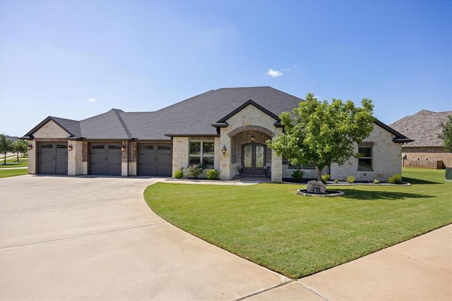 Welcome to your dream lakefront oasis! This stunning, custom-built home is nestled on a coveted corner lot in The Island, one of Granbury, Texas's most desirable neighborhoods. With a captivating curb appeal, the home boasts a grand circle drive and a spacious three-car garage.

Step inside and be greeted by an impressive open floor plan, where soaring ceilings and abundant natural light create an inviting atmosphere. The gourmet kitchen, featuring high-end appliances and custom cabinetry, seamlessly flows into the living and dining areas, making it perfect for both everyday living and entertaining.

The home offers four spacious bedrooms and three full bathrooms, providing plenty of room for family and guests. The expansive master suite is a true retreat, offering privacy and breathtaking views.

Head outside to your personal paradise. The backyard is a haven for relaxation and recreation, with a sparkling pool overlooking the tranquil waters of Lake Granbury. Your private dock provides direct access for boating and water activities. This property is more than just a home; it's a lifestyle. Don't miss this opportunity to own a piece of paradise in Granbury!