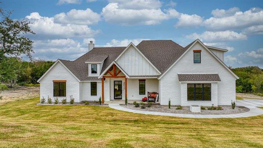 Step inside to admire the customization & designer features thruout! You're greeted by a spacious open concept that flows seamlessly from room to room. The living room is adorned with a vaulted ceiling creating an airy & grand atmosphere, emphasizing the homes elegance. The gas start wood burning fire place & all the stained beam work warms this custom home. The kitchen is a true chefs dream with its GE gas cooktop quartz counters sprawling island oversized ceramic apron sink & high-end finishes. Butlers pantry with appliance outlets & layers of shelves. The Primary Suite is a sanctuary of luxury & comfort complete with tray ceiling oversized windows & spa-like ensuite bath. Resting on a generous 2-acre lot with ample space for the outdoors, a shop & pool. Three more bedrooms split across the home, one with its own ensuite bath, a perfect guest or in-law suite. Upstairs is a 5th bedroom, office or bonus room with closet & FULL bath. Virtual tour & more txt keyword TEXAS22 to 88000.