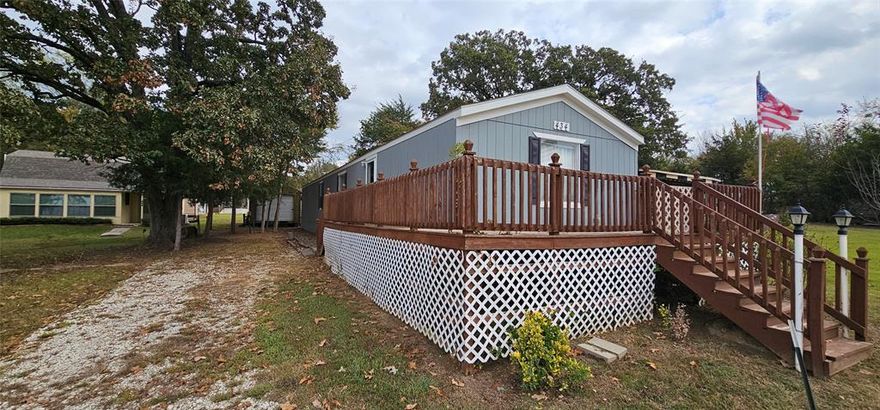 Cozy & Spacious Lake Community Home – Move-In Ready! This super spacious 2-bedroom, 2-bath home has the perfect layout for comfortable living! The split-bedroom floor plan offers plenty of privacy, with a large primary suite featuring dual vanities, a walk-in shower, and a dream closet with tons of space. The open kitchen, dining, and living areas flow beautifully—ideal for everyday living or entertaining friends and family. Located in a wonderful lake community, you’ll enjoy great amenities including a pool, fishing, boat ramp, playground, basketball court, and more! The home is in great condition and move-in ready. Plus, there’s a handy storage building with both roll-up and walk-through doors for all your tools, toys, or hobbies. 
Whether you’re starting out or looking to downsize and enjoy a relaxed lifestyle near the water, this home has it all!