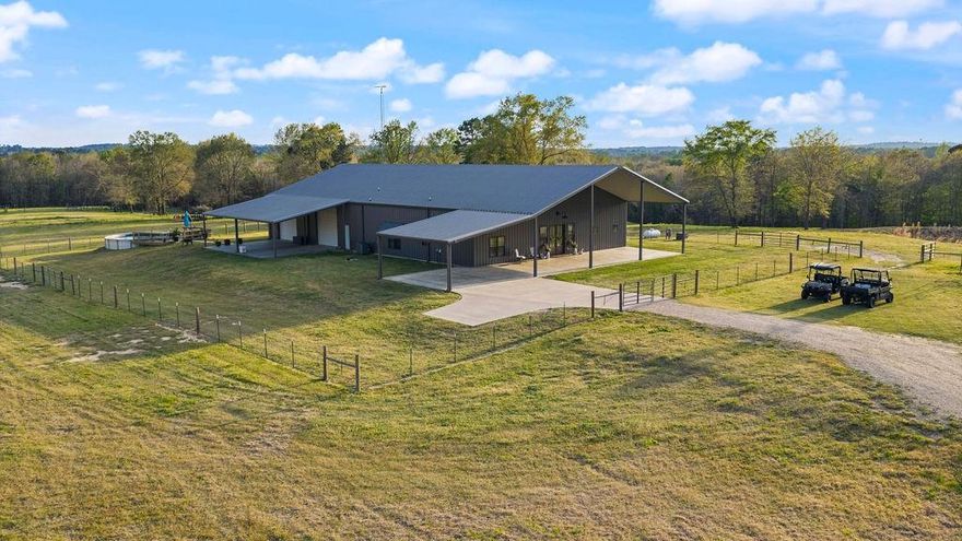 The Ultimate East Texas Legacy Ranch: 54.6-Acre Custom Estate. 6,000+ sq ft under roof. Discover the perfect balance of luxury and the rugged freedom of the Texas landscape on this gated 54.6-acre property. Built with an obsession for quality, this custom home offers 3,450 sq ft of living space defined by soaring vaulted ceilings, real wood accents, and designer quartz and tile throughout. The heart of the home is an open-concept masterpiece designed for hosting, while the flexible 450 sq ft upstairs loft serves as a versatile fourth bedroom, theater room, or home office. The lifestyle here is defined by wide-open spaces and effortless recreation. Imagine starting your morning with coffee on the patio as the sun rises over two stocked ponds, then hopping on an ATV to explore miles of private trails and cross-fenced pastures perfectly suited for hay and livestock. For the craftsman or collector, the 3,000 sq ft insulated shop is a premier feature, boasting four oversized roll-up doors for seamless equipment access and a massive workspace. For additional space, a barn and lean-to are in place and for your farm equipment and animals. This property combines modern amenities with classic country utility, featuring seller-owned solar panels for energy efficiency, a private storm shelter, a chicken coop and a classic windmill. Dual road frontage with multiple gated entries provides excellent accessibility across the entire Ag-exempt acreage. Whether you are casting a line for a morning catch, tending to the land, or relaxing by the pool, every inch of 1132 CR 4470 exudes custom quality and peace. Secure your piece of Winnsboro’s finest acreage today.