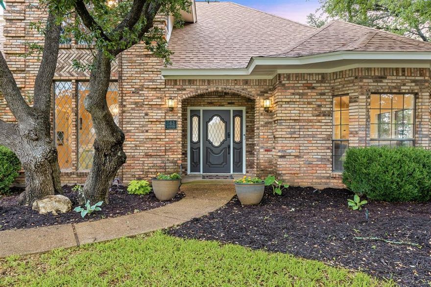 Back on Market (cold feet). Beautiful updates, charming details, a pool, a workshop, and one beautiful sunset view over a stocked bass fishing tank converge on over 1.5 acres feeding Aledo ISD in desirable Remuda Ranch Estates. Known for its custom homes, tree-lined streets and quiet country setting, this neighborhood sits conveniently located just over 20 minutes from Fort Worth. The interior feels fresher than a Spring daisy thanks to the all-new luxury vinyl plank flooring, recently replaced carpet, neutral interior and exterior paint, upgraded lighting, elevated hardware and spruced-up bathrooms. The floor plan flows and functions beautifully with tons of storage, two living areas, two dining spaces, and a spacious primary suite with views of the backyard and a serene, spa like ensuite bath. The kitchen enjoys newer appliances (dishwasher, electric range and fridge) and soft close kitchen drawers. The detached additional 2 car garage comes with tons of storage and a fully finished-out man cave behind - offering room for a gym, office, or DIY space. The immediate backyard enjoys gorgeous views, privacy, new pool perimeter fencing and custom rustic Adirondack chairs around a fire pit area. New pool pump motor, new pool main pump, and a new window unit for the man cave - because hanging out requires temperature control! New roof installed 2023, new HVAC unit 2024, and new aerobic septic system just installed this year! Don't miss the shoreline of that stocked tank - just within the surveyed boundaries of this property. This is country living in style - with comfort, convenience and fun thrown in!