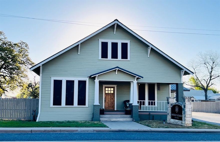 Live & Work all in one place! This 1910 2 story once served as a lovely family home & is now a gorgeous office space (with upstairs apartment) just a block off the square! Step inside & right away you'll be impressed with the vaulted ceilings, wood floors and character throughout! The inside was tastefully renovated in 2021 & the outside in 2024. The upstairs apartment is a 1 bedroom, 1 bath with kitchen & living space. Downstairs you'll find 5 office's, a reception area, half bath and kitchen area that serves as a breakroom. The front porch or side patio is a great place to enjoy a cup of coffee. There's plenty of room for parking & a C container for storage! Imagine the possibilities!