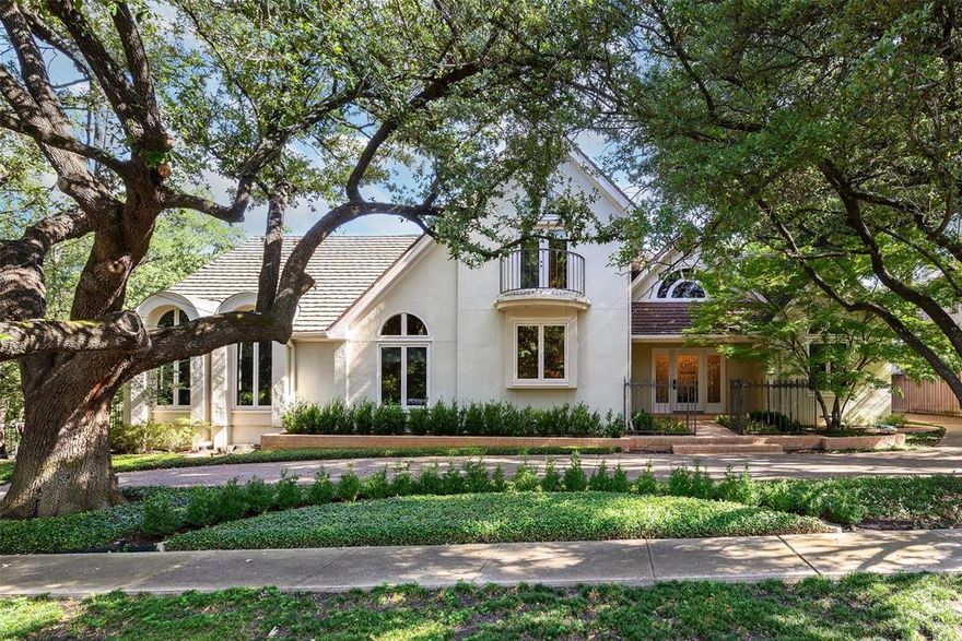 3918 Normandy is a unique Highland Park home that was custom-built for the current owners in 1986 by the modernist architectural firm Oglesby Group. This soft-contemporary gem is located at the end of a coveted quiet cul-de-sac block, with incredible views overlooking beautiful Turtle Creek and the Dallas Country Club golf course. The home’s open-concept living space boasts floor-to-ceiling windows, custom built-ins, beautiful original hardwood floors and a gas fireplace. The floor plan features four bedrooms and 5.1 bathrooms, offering ample room for both entertaining and family living. The gracious entry flows into an expansive living room and dining room with amazing views of Turtle Creek and the Dallas Country Club golf course. The kitchen includes a central island, granite countertops, stainless-steel appliances and two walk-in pantries. The butler’s pantry connects the formal dining and breakfast room, offering ample storage and facilitating entertainment. There is also an impressive study with paneling and built-ins, privately located on the other side of the entry hall from the living areas. The first-floor master suite provides a serene retreat, a sitting area complemented by a mosaic tile fireplace, and a Juliette balcony overlooking the sparkling pool and with beautiful views of Turtle Creek and the Dallas Country Club golf course. The expansive primary bathroom features dual vanities, water closets, a jetted tub, a separate shower, and separate oversized walk-in closets. Three additional bedrooms include full bathrooms and walk-in closets. On the lower level, a Saltillo tile game room with a full bathroom and wet bar opens to the wraparound deck and private pool oasis, offering stunning vistas of the creek and extensive landscaping. The 100x180 landscaped lot is a standout in Highland Park, conveniently positioned between Mockingbird and Hillcrest, and within close proximity to Highland Park High School, HP Village and various parks, shops and dining.