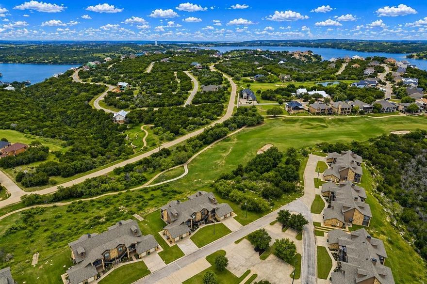 Turnkey lake living awaits in this beautifully furnished 2 bedroom, 2 bath ground floor end unit at The Cliffs Resort on Possum Kingdom Lake. Offering a rare combination of convenience and privacy, this single level condo is perfect for a lock-and-leave lifestyle. Enjoy the added bonus of being able to catch the iconic Hells Gate 4th of July fireworks right from your own retreat. The end-unit location provides a more spacious feel, while the ground-floor access makes coming and going effortless. A private gate from the back porch and side door offers direct access to a side grassy lawn, ideal for relaxing, pets, or outdoor enjoyment. Residents of The Cliffs Resort enjoy an unmatched amenity access including 36 rounds of golf annually, 24-7 gated security, multiple swimming pools, a private beach, marina, on-site restaurant, tennis courts, fitness center, and hotel accommodations for guests. Whether you're looking for a weekend escape or a low-maintenance full-time residence, this condo delivers the ultimate resort-style experience on PK Lake.