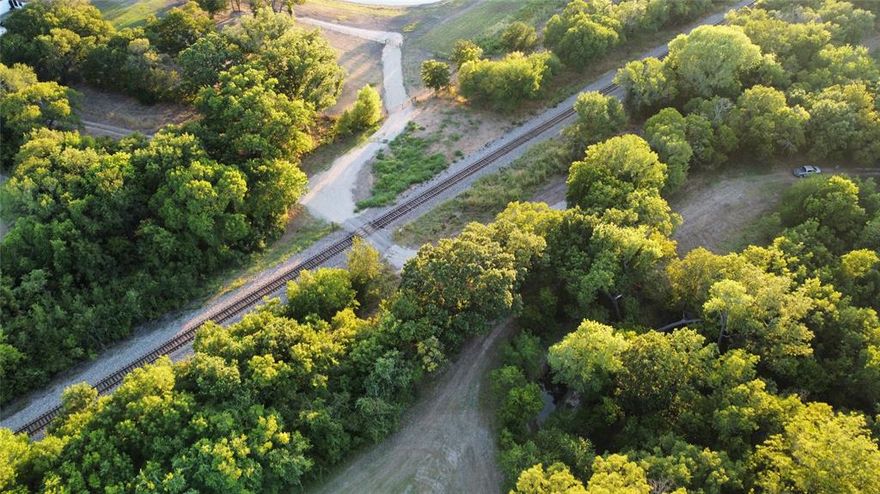 Beautiful Farm with Clearfork Branch running thru property.  RR road crossing on property.  Trees, brush and pastureland.  Property has been used as farm for years, cattle and crops.  Please view photos and videos they will tell the story of this hidden beauty.  Completely fenced.