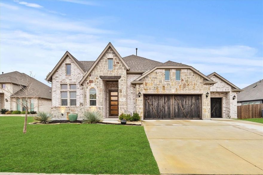 This Stunning 5-year-old home in the desirable Stone River Golf Community offers the perfect blend of modern luxury and serene golf course living. Located directly on the golf course with prime views overlooking hole 4, this like-new residence delivers an exceptional lifestyle just minutes from Rockwall and Royse City amenities. Features include 3+ office bedrooms and 2.5 baths, a spacious 3-car garage, soaring cedar beams in the living room, and a stone floor-to-ceiling fireplace that serves as a striking focal point for gatherings. The deluxe kitchen is a chef's dream, complete with a large center island, premium quartz countertops, a gas cooktop, high-end stainless steel appliances, upgraded cabinetry, Culligan water purifying and softening system throughout the house, and a charming buffet in the breakfast nook for effortless entertaining. Quartz surfaces extend seamlessly into the bathrooms and laundry room, adding a touch of elegance throughout. Entertain outdoors on the extended covered patio, where you can relax and take in breathtaking views of the fairway, ideal for morning coffee, evening barbecues, or simply enjoying the peaceful golf course scenery. Built just four years ago, this meticulously maintained home combines contemporary upgrades with the tranquility of golf course living in a welcoming community. Don't miss this rare opportunity to live on the course at Stone River!