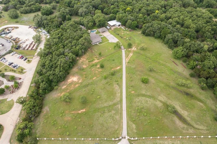 Welcome to this exceptional 12-acre property, a private and picturesque retreat nestled among mature trees and natural beauty. Enter through the two private gates, each with cattle guards, for ultimate privacy. As you approach, you’ll be greeted by a stunning open meadow, the perfect introduction to the heavily wooded and serene landscape beyond. At the heart of the property is a beautiful in-ground pool with an adjoining studio-style pool house, ideal for guests or entertaining. A real gem for hobbyists is the massive barn, spacious enough to accommodate large RVs, boats, and more. Additional covered parking adjacent to the barn provides even more storage for oversized vehicles or equipment. Whether you’re seeking a peaceful homestead, a place to keep horses or cattle, or simply a unique and well-equipped rural escape, this property offers endless potential. With lush pastures, towering trees, and beautiful structures, this is a rare find you won’t want to miss.