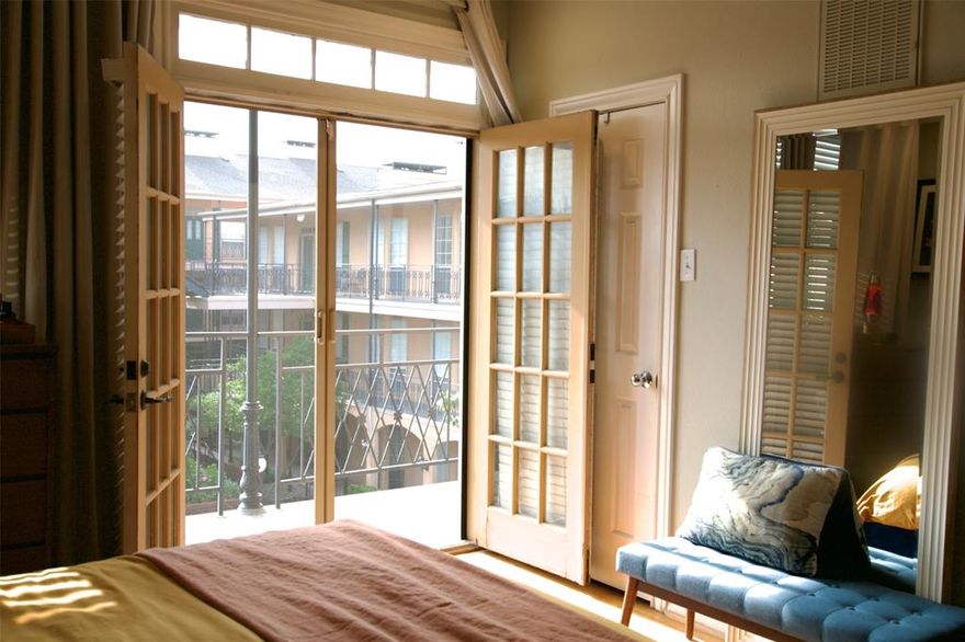 Luxury living meets timeless charm in this rare top-floor corner condo in the heart of Lakewood Village. Thoughtfully redesigned and renovated with quality craftsmanship, this move-in-ready residence blends modern elegance with classic New Orleans-inspired architecture, surrounded by lush courtyards and magnolia-lined walkways. Filled with natural light, the open-concept layout features vaulted ceilings, rich hardwood floors, and a cozy fireplace. The desirable corner location offers privacy while close to the elevator. French doors with custom magnetic sliding patio screens open to a covered balcony with views of the iconic Lakewood Theatre and sparkling community pool. Designer bathroom completely redesigned with a sleek walk-in shower, matte black hardware, new vanity, mirrors, medicine cabinet, modern lighting, ceramic tile flooring, subway tile surround, fresh paint, and new toilet. Includes a premium custom-fit Asko washer and dryer, Elfa shelving, and added storage. Custom kitchen beautifully renovated with navy blue cabinetry, elegant quartz countertops, custom tile backsplash, Blanco sink, upgraded faucet, and all new stainless steel appliances including refrigerator, dishwasher, microwave, and range. Upper cabinets were removed and a new cutout window added to create an open, airy flow between kitchen and breakfast area. Located in a gated community with entrances on both sides, residents enjoy a pool, clubhouse, guest parking, and additional street parking. HOA includes gas, water, exterior maintenance, landscaping, and pool care for true lock-and-leave convenience. Ideally situated near Lakewood Shopping Center, Whole Foods, local boutiques, dining, and entertainment, with close proximity to White Rock Lake and Lower Greenville. This up-and-coming area continues to attract strong local investment. A rare opportunity to own a fully renovated home in one of Dallas’ most desirable neighborhoods, designed to impress and priced to attract immediate attention.