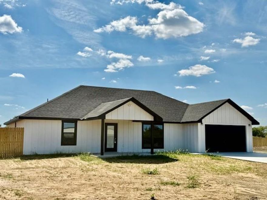 OMG!  Come home to the country and picture yourself in this new build located just a mile off of US 82 between Honey Grove and Petty. It is a must see!   Just completed and needing a new occupant to call this one their own.   Just over an acre lot with the house strategically placed on the lot to provide a new owner room to build a shop.  Welcome into this new home through the wide, open entry way into the spacious and inviting living area. Luxury vinyl plank throughout the house, easy to maintain and allergy free.  Plenty of room for large furniture with windows letting the natural light in.  Open kitchen-dining area with lots of counter space and a work island that can double as a breakfast bar.  Custom cabinetry. Stainless appliances, cookstove, microwave and a side-by-side refrigerator.  Primary bedroom is nice sized with private bath and a walk-in closet.  Across the living area are 2 additional bedrooms and a nice hall bath.  The oversized utility room is plumbed for an extra refrigerator and receptacle for an extra freezer or appliance.  Enjoy morning coffee, afternoon breezes on the large, covered patio. The huge backyard is perfect for a vegetable garden, play equipment or whatever.  Privacy wood fence on east and west side of the property divides this lot from the adjoining properties affording the new owner privacy.  All this and a 2-car garage with remotes.