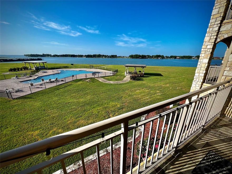 Welcome to your fully furnished waterfront retreat! Whether you're looking for a weekend getaway or a fulltime home, this move in ready condo affords the relaxing, lake lifestyle property you've been searching for all for under $300,000!!! Beautiful, intricately designed upgraded vinyl floors! Huge balcony with patio furniture to relax and enjoy the water view! 2 full bathrooms with generously sized showers enclosed in frameless glass. The updated kitchen features a large island with ample seating all open and focused toward the captivating views.  Come make this property yours and live everyday like it's vacation!