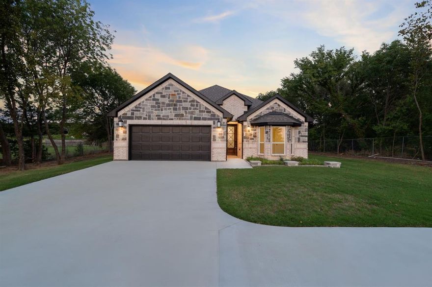 Seller is offering 5k seller credit towards closing cost with an accepted offer!
Welcome to this beautifully designed brick and stone home in a .42 acre lot that perfectly blends modern elegance with timeless curb appeal. Featuring a striking exterior with dark trim accents and a spacious driveway & freshly stained wood fence for privacy and security in the front. Did I mention NO HOA?!
 Step inside to an inviting open floor plan filled with natural light and high ceilings. The spacious kitchen seamlessly connects to the living and dining areas, making it ideal for entertaining or everyday living. The home offers a generous primary suite with a private bath with his and hers sinks, & bathtub.  Experience luxury living with thoughtfully designed bathrooms with exquisite finish outs!