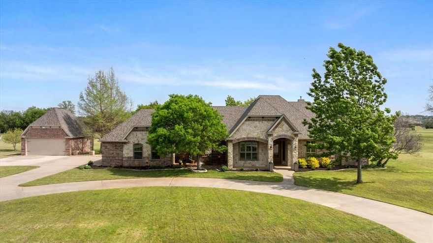 Located in the prestigious, gated community of The Peninsula, this exceptional single-story estate offers over 4,000 square feet of thoughtfully designed living space with room for everything. Featuring 6 spacious bedrooms and 5 bathrooms—including a Jack-and-Jill layout between 2 bedrooms—each bedroom enjoys convenient access to its own bath, providing comfort and privacy for family and guests alike. The open-concept living area impresses with soaring ceilings, expansive windows that flood the space with natural light, and a stunning floor-to-ceiling rock fireplace as the focal point. The chef’s kitchen is equally remarkable, showcasing a wraparound bar island, gas cooktop, built-in refrigerator, and gorgeous custom cabinetry. A breakfast room just off the kitchen and a formal dining room ensure effortless entertaining for both everyday living and special occasions. The oversized primary suite is a true retreat, complete with a sitting area and a see-through fireplace that opens to the luxurious en-suite bath—creating a spa-like atmosphere. Step outside to your own private oasis on 2.3 acres, where mature landscaping, a secluded courtyard, and a covered porch overlook a sparkling pool with a waterfall feature—perfect for relaxing or entertaining. Additional highlights include a detached 2-car garage (for a total of 5 garage spaces), a dog washing station in the garage, second refrigerator in the mudroom, washer and dryer, five mounted TVs, and a water softener system.

This home truly stands apart with its blend of luxury, functionality, and space—an incredible opportunity in one of the area’s most sought-after Lake Granbury communities.