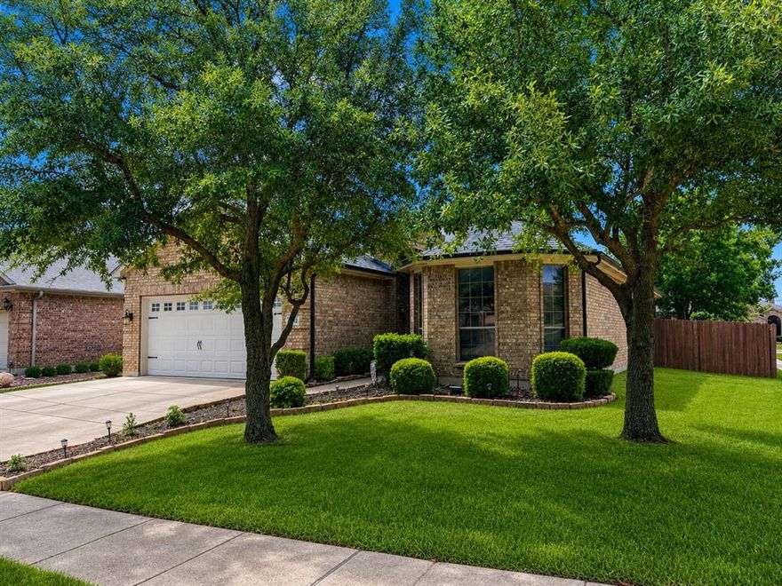 Welcome to this beautifully updated ONE-STORY home in the highly sought-after Villages of Woodland Springs, zoned to acclaimed Keller ISD Offering 3 bedrooms, 2 bathrooms, and an ideal open-concept layout, this home combines comfort, style, and functionality in one of the area’s most desirable master-planned communities.

Step inside to discover rich wood flooring, abundant natural light, and a spacious flexible living area just off the entry that can easily serve as a formal dining room, home office, or second living space. The oversized kitchen is truly the heart of the home, featuring extensive cabinetry, a center island, counter-height breakfast bar, and seamless flow into the inviting living room anchored by a stunning stone fireplace.

The private primary suite offers a relaxing retreat with an en-suite bath complete with dual vanities, a garden tub, separate shower, and a spacious walk-in closet. Secondary bedrooms are generously sized and thoughtfully positioned for privacy.

Outside, enjoy a private backyard designed for entertaining and relaxation with an extended concrete patio and recently installed 8-foot board-on-board fence. Additional highlights include a full-size laundry room and attached two-car garage.

Residents of Villages of Woodland Springs enjoy exceptional resort-style amenities including six community pools, a recently renovated amenity center, tennis and pickleball courts, basketball and sand volleyball courts, stocked fishing ponds, playgrounds, parks, and miles of scenic greenbelt trails perfect for walking and biking. The neighborhood also hosts community events year-round that create a true sense of connection and community.

Conveniently located near shopping, dining, entertainment, and major highways, this home offers the perfect combination of lifestyle, location, and top-rated schools. Don’t miss your opportunity to own this move-in ready gem in one of North Fort Worth’s most desirable neighborhoods!