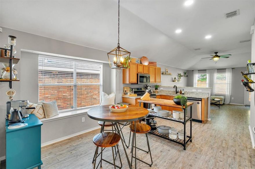 What makes this starter home so special? 1) MORE UPGRADED: LVP Floors, Granite Counters, SS Apps, Light Fixtures & Faucets = The Expensive Stuff is Already Done. 2) GOOD BONES: ROOF 6 Yrs Old. 3) NO FIREPLACE: Zero Wasted Space. 4) BACKYARD: PARTY PAD + EXPENSIVE NEW FENCE! 5) COMMUNITY: Locals call this place The VOWS. 6 pools to choose from, walking-bike trails, multiple fishing ponds, tennis & pickleball courts & monthly activities. This home is bigger than it looks from outside. Front entry drop zone lead to the big open kitchen and living area. Waterproof LUXURY VINYL PLANK FLOORS in the important areas, carpet in the bedrooms. Centrally located kitchen is the true heart of this home with granite counters, GAS COOKTOP (1800 BTU's), stainless steel appliances, oversized sink & HUGE PANTRY built for real-life functionality. Double window wall in the living room allows you to watch the sun rise in the back of the home for beautiful light in the morning & summer setting sun heat is blocked by garage. The main living room measures 15-ft W x 13-ft L, NO FIREPLACE so there's plenty of space for big sectional couches. 10' ceilings in the central living space make it light, bright & airy all day long. Split beds- smaller rooms up front & private primary in the back. PRIMARY BATH: Granite vanity & tub-shower (2 tubs in this home). *EV CHARGER* in the garage! NEW 8-FT BOARD-ON-BOARD FENCE & SITTING AREA create a cool vibe to enjoy nice evenings by the fire pit. PET FRIENDLY: Screened back door with dog door. Easy to maintain yard & landscape with full-lot sprinkler system. Prime North Ft. Worth Alliance Corridor close to Heritage Trace shopping, KELLER ISD, entertainment & more. DFW Airport is 20 minutes thanks to 170. Low Tarrant County taxes. FHA & VA buyers welcome! Great condition & price point for first-time buyer or turn-key landlords. Move-in ready! Fridge, washer & dryer are negotiable.