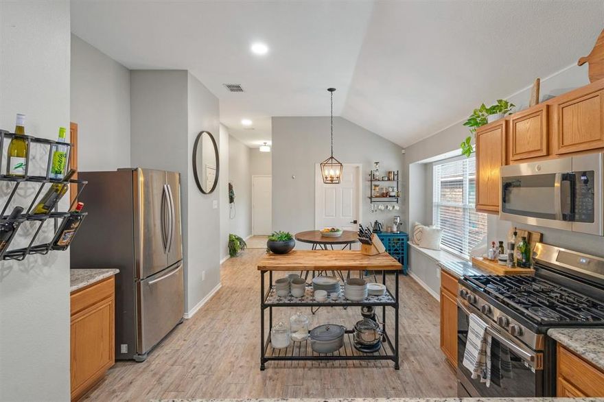 What makes this little cutie so special? 1) MORE UPGRADED: LVP Floors, Granite Counters, SS Apps, Light Fixtures & Faucets = The Expensive Stuff is Already Done. 2) GOOD BONES: ROOF 6 Yrs Old. 3) NO FIREPLACE: Zero Wasted Space. 4) BACKYARD: PARTY PAD + EXPENSIVE NEW FENCE! 5) COMMUNITY: Locals call this place The VOWS: 6 pools to choose from, walking-bike trails, multiple fishing ponds, tennis & pickleball courts & monthly activities. Once inside, the front door & garage entry door open to a large tiled foyer drop zone for shoes & coats, backpacks & pet supplies. Waterproof LUXURY VINYL PLANK FLOORS flow in the traffic areas, kitchen, living & wet areas. This kitchen is the heart of this home- guests can visit with the chef from the dining or family room side. KITCHEN: Granite counters, GAS COOKTOP (1800 BTU's), SS Apps, oversized sink & HUGE PANTRY built for real-life functionality. Double window wall in the living room allows you to watch the sun rise in the back of the home for beautiful light in the morning & summer setting sun heat is blocked by garage. The main living room measures 15-ft W x 13-ft L, NO FIREPLACE so there's plenty of space for big sectional couches. 10' ceilings in the central living space make it light, bright & airy all day long. Split beds- smaller rooms up front & private primary in the back. PRIMARY BATH: Granite vanity & tub-shower (2 tubs in this home). *EV CHARGER* in the garage! NEW 8-FT BOARD-ON-BOARD FENCE & SITTING AREA create a cool vibe to enjoy nice evenings by the fire pit. PET FRIENDLY: Screened back door with dog door. Easy to maintain yard & landscape with full-lot sprinkler system. Prime North Ft. Worth Alliance Corridor close to Heritage Trace shopping, KELLER ISD, entertainment & more. DFW Airport is 20 minutes thanks to 170. Low Tarrant County taxes. FHA & VA buyers welcome! Great condition & price point for first-time buyer or turn-key landlords. Move-in ready! Fridge, washer & dryer are negotiable.