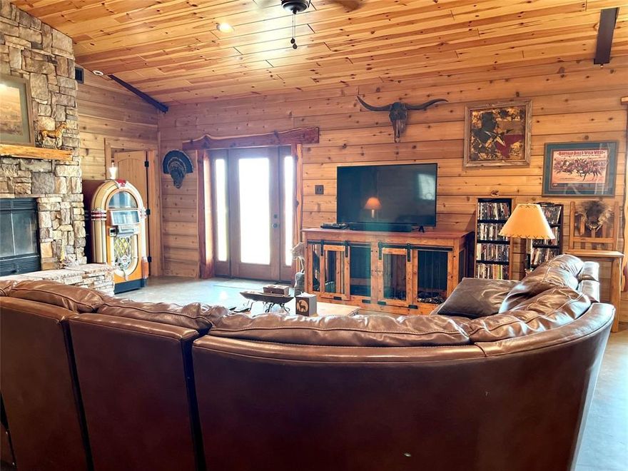 Beautiful RANCH HOUSE with HORSE BARN and TRAINING FACILITY along with DOG KENNEL. Dive into the comfort of this 4-bedroom, 3.5-bathroom Barndominium, spread across 2400 sq. ft. on a sprawling 12-acre plot.

The property boasts a Barn-master barn with 5 stalls, a tack room prepped for amenities, and a wash rack. An additional 5-stall metal shed row barn stands ready, alongside a spacious fenced arena designed for equestrian activities. Multiple fenced paddocks and a metal equipment storage structure. 

The home is surrounded by nearly 2.5 acres of mature and native trees. The Bermuda pastures, with cushion sand, lead to a 1-acre POND, equipped with its own well and pump, and home to bass and perch.

The kitchen shines with granite countertops and stainless steel appliances. The living area is anchored by a stone fireplace, and the master suite offers a tranquil stone shower. Haven for those seeking the serenity of country living with city conveniences nearby.