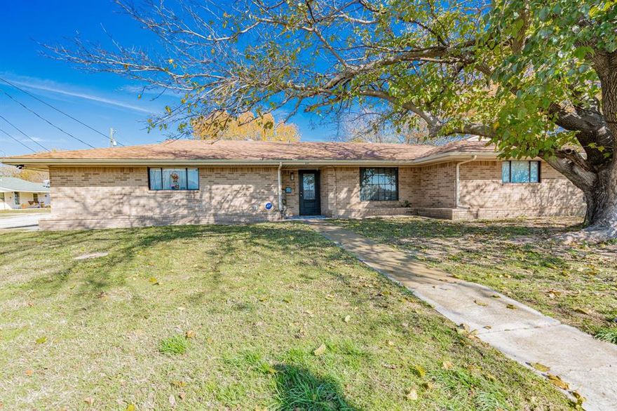 Beautiful 4 bedroom 3 bath home ready for a new year and a new family! At 2,156 sq ft this home has plenty of room for you and yours and of course all the fur babies. The second primary bedroom located on one side of the house makes it perfect for a mother in laws living quarters. Quartz counter tops in the kitchen and bathrooms, luxury vinyl plank flooring in the common areas and carpet in the bedrooms. This corner lot is across the street from the Bowie ISD Itermidiary school making it ideal for families as well as having the track for walking or running. Out back you have a 2 car garage with an oversized carport tall enough for an RV. Bowie is small town living with plenty of amenities like local botique shopping, multiple restraunts and multiple grocery stores. Call or text for a private showing and make this house your new home for the year 2025