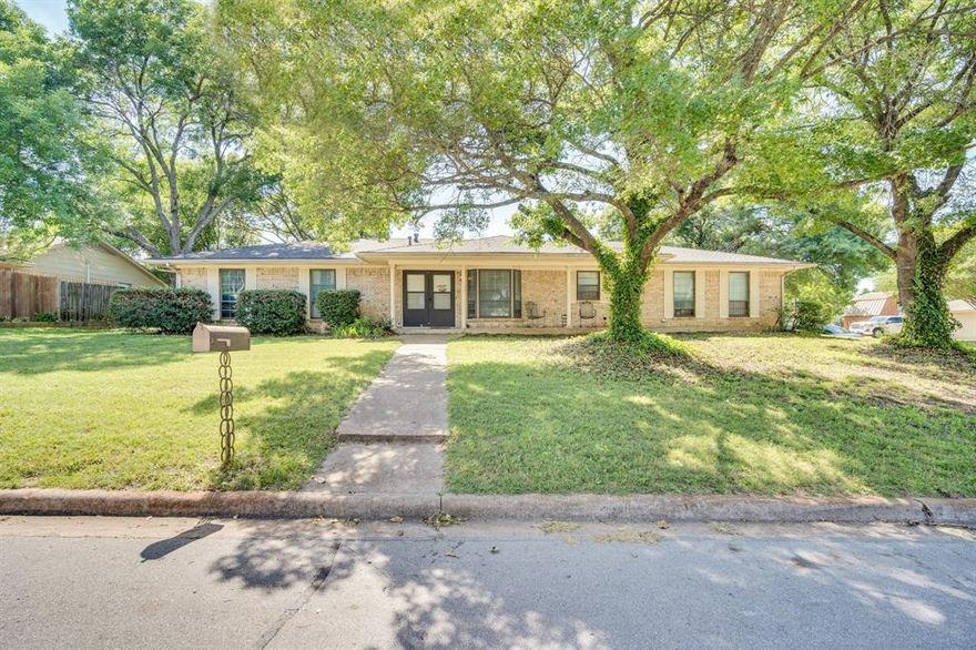 Welcome to this charming family home nestled on a spacious corner lot shaded by beautiful mature trees. Filled with warmth and character, this inviting property offers 3 bedrooms, 2 bathrooms, a flexible office-hobby space that could also serve as an additional bedroom, a comfortable living room, a bright sunroom, and a converted garage bar area—perfect for entertaining family and friends. Plus, enjoy peace of mind with a new roof less than one year old.  Step outside to discover separate guest quarters in the backyard, complete with a private bedroom and bathroom, making it an ideal retreat for visiting guests, multigenerational living, or a young adult seeking privacy and independence. The fenced backyard also features an automatic gate for added convenience and security.  With plenty of space to gather, relax, and grow, this inviting home is ready to welcome its next family. Don’t miss the opportunity to make this awesome property your own!