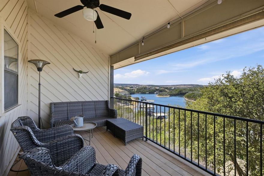 Lakefront, furnished including optional transferable 11x24 covered boat slip at Bluff Creek Marina! Truly lock and leave, this beautifully maintained condo in Sportsman's World is your easy button to Possum Kingdom living. Whether you are looking for a weekend escape or a low maintenance investment, this one checks the boxes. Let the HOA handle the exterior upkeep while you focus on lake days and sunset views.

Inside you will find light neutral tones, updated lighting and an open concept layout that feels bright and inviting. The kitchen features stainless appliances, generous counter space and a breakfast bar that flows seamlessly into the dining and living areas. Soaring ceilings and a stunning wood loft overlook the main living space, creating character and extra flexibility. The spacious loft is currently used as a bedroom and offers plenty of room for guests, bunk space or a second living area.

Step outside to your private balcony and take in panoramic Possum Kingdom views. Morning coffee and evening sunsets never get old from this vantage point. An exterior storage area makes it easy to keep lake gear organized, and one covered parking space conveys with additional on site trailer parking available.

Located in the heart of Sportsman's World, owners enjoy access to resort style amenities including a swimming pool, tennis courts, playground, and the award winning Bluff Creek Marina with boat ramp, boat sales and service, fuel dock and waterfront dining. The community also offers horse stables, private airport, and guarded entry for added peace of mind. Paradise Villas owners have their own lakeside area perfect for gathering with family and friends.

If you have been waiting for an easy, furnished lakefront retreat with incredible amenities and sunset views, this is it. Pack your bags and start making memories at Possum Kingdom.