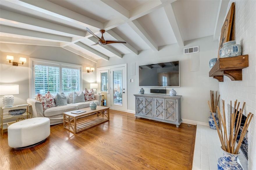 Charming brick home on the magical block of 6600 Patrick Drive. Updated kitchen and baths, hardwood floors, plantation shutters, vaulted living room ceiling, all season sunroom, and rear oversized rear entry detached garage with electric gated access. Backing up to green space and located within the highly coveted Lakewood Elementary boundaries, this isn't just a home—it’s an entry into one of Dallas's most storied communities. 3rd bedroom currently utilized as second living room but can easily accommodate guests or kids if 3 bedrooms is required.