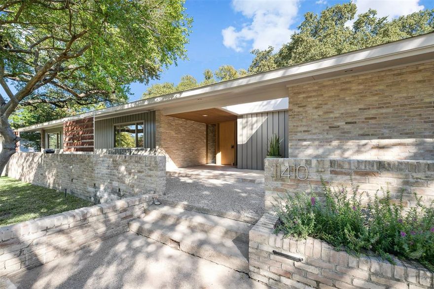 Discover the pinnacle of Mid-Century Modern elegance in this fully reimagined estate nestled in the heart of Janmar in North Dallas. Taken down to the studs by the current owners and thoughtfully rebuilt, this home blends timeless 1950’s architecture with today’s most luxurious upgrades. Every detail was considered—from new plumbing, electrical, foam insulation, windows, & fencing, to custom rift white oak cabinetry and white oak floors. The chef’s kitchen stuns with an 8-foot leathered quartzite island, Bertazzoni built-in refrigerator & dishwasher, and a five-burner DSC commercial-grade range with double ovens. Floor-to-ceiling windows flood the open-concept living, dining, and family spaces with natural light, creating a warm and inviting flow to the expansive outdoor living area featuring multiple patios, a built-in kitchen, and a resurfaced pool with updated equipment, hot tub, and surrounding turf for low-maintenance elegance. After a tough day, head the built-in infrared sauna to relax. Sitting on a beautifully manicured half-acre corner lot, the backyard also offers a large grassy area ideal for children-pets. In 2023, the oversized garage was rebuilt to include a 1133 sq ft workout room with an additional upstairs stylish secondary living space complete with kitchen, living-bedroom, bath, and office—perfect for guests, a home office, or private retreat. The home features 4 spacious bedrooms & 3 renovated bathrooms, including a luxurious primary suite with soaking tub, quartzite counters & a beautifully tiled walk-in shower. An oversized laundry area has an abundance of cabinets and counter with room for a refrigerator. With original architectural elements preserved and only the finest materials used throughout, this home offers a rare blend of authenticity and modern comfort—perfect for family fun and entertaining friends. Just min. from downtown, top private schools, shopping, fine dining, and major airports.