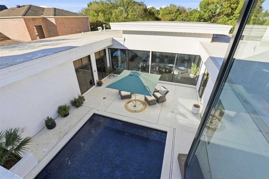 Discover a rare opportunity to own an exceptional piece of modern Fort Worth real estate. Never before listed in MLS, this striking 4,700-square-foot residence blends crisp contemporary design with an inviting retro flair. With generously proportioned rooms, thoughtful architectural details, and outstanding indoor-outdoor flow, 5625 El Campo is a property you won’t want to miss.

This home features 2 bedrooms, 2 full baths, and 3 half baths, with the flexibility to transform the spacious upstairs great room into a third bedroom, private office, or additional living area. The possibilities are endless. Upon entering, you are welcomed by an impressive 23-foot foyer that leads to a sunken bar—an ideal setting for entertaining. Whether hosting dinner in the expansive dining area or relaxing in the oversized living room, the home’s layout offers seamless spaces for gatherings of any size.

The downstairs primary suite serves as a luxurious retreat, complete with wood flooring, abundant natural light, and two large closets offering exceptional storage. The spa-inspired primary bathroom opens directly onto the private pool deck, creating a serene and seamless connection to the outdoors.

The kitchen is thoughtfully designed with contemporary cabinetry, stylish lighting, a gas range, and extensive storage that will satisfy any culinary enthusiast. Upstairs, guests are treated to their own private haven. Separate from the primary suite, the upper level includes a generous guest bedroom, an office area, and a versatile TV-office space that overlooks the sparkling pool—perfect for visitors seeking both comfort and privacy.

This distinctive home combines architectural character, modern amenities, and exceptional livability, making it a standout opportunity in one of Fort Worth’s most desirable areas.