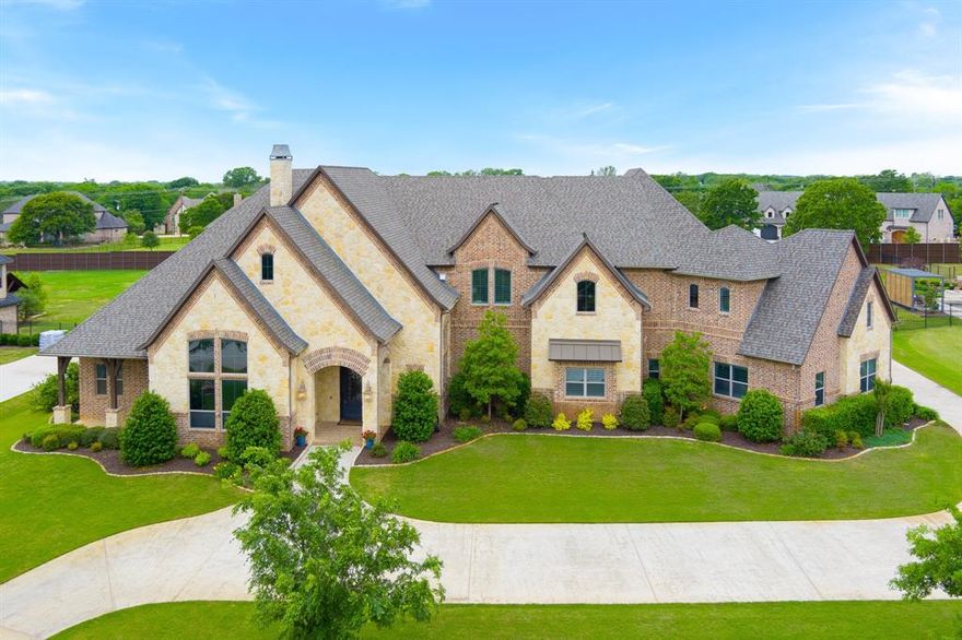 Discover the pinnacle of luxury living in this hi-tech smart home on a sprawling 1-acre lot. Experience the sophistication of soaring cathedral ceilings, hand scraped hardwoods & seamless indoor-outdoor living. Gourmet kitchen is a culinary dream featuring a massive granite island w chop sink, built-in refrigerator, warming drawer, double ovens, gas range & dry bar with w storage & mini kegerator. Entertain effortlessly with a chef's outdoor kitchen complete w Big Kamado Joe, gas grill & beverage refrigerator. Relax in the saltwater pool & spa while your Husqvarna auto lawnmower takes care of the yard. Indulge in amenities like a home theater, gym, and oversized study w fireplace. Feel safe and secure w a tornado shelter & multiple outdoor cameras. Hard to find 5-car garage w Tesla powerwalls, EV charger & 6th bedroom. High energy efficiency w spray foam insulation, Nest thermos, well water lawn irrigation, tankless hw heaters & top of the line fully owned solar panels. New roof 2023!