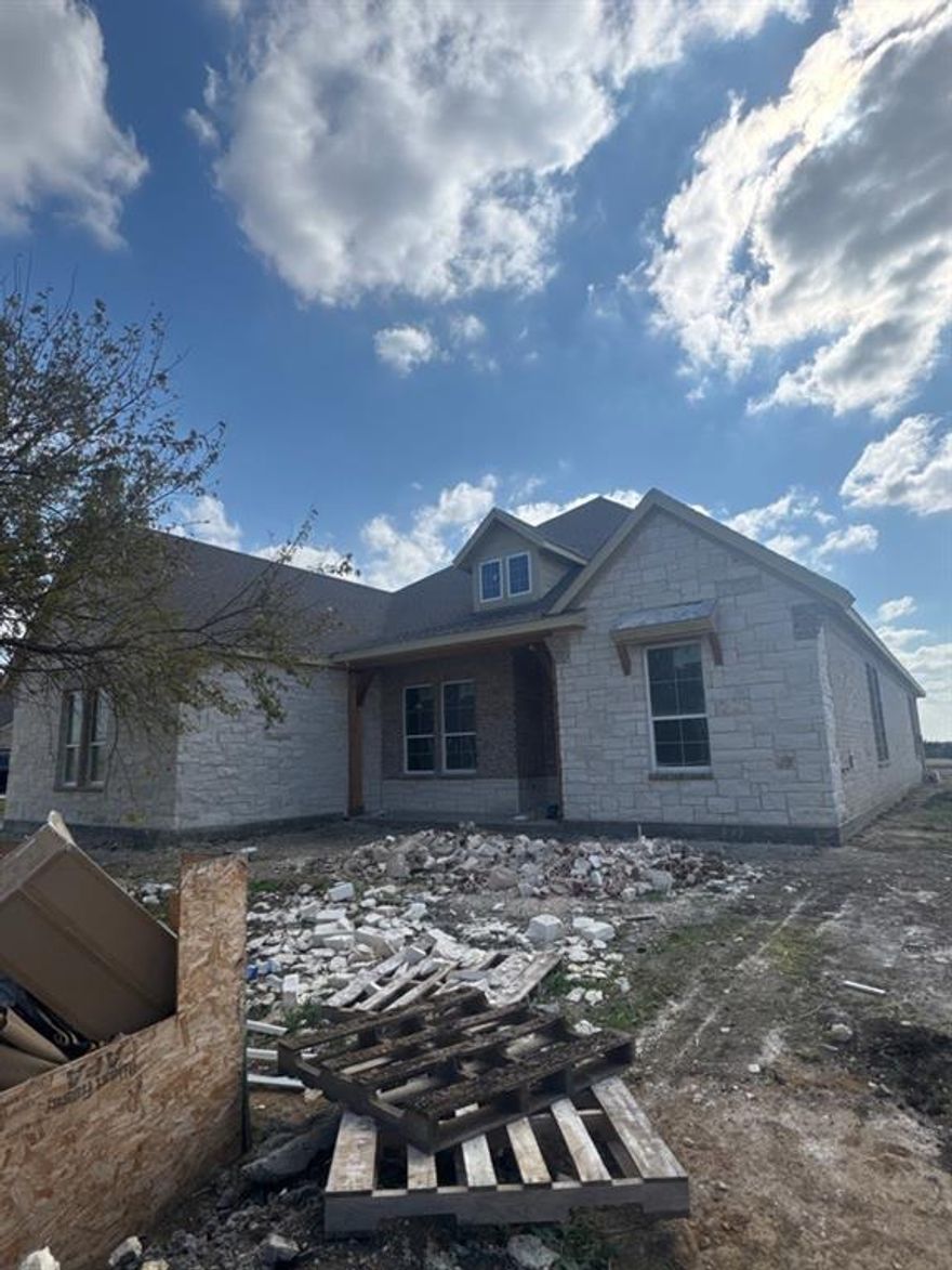 Estimated January 2026 completion! Ask us about our Trade In Trade Up program, we can buy your home! Step into the Bluebonnet by Riverside Homebuilders and embrace a lifestyle of comfort and functionality. With 4 bedrooms and 3 bathrooms sprawled over 2,686 square feet, this single-story haven offers ample space for every member of the family. As you enter through the inviting porch, the airy foyer sets the tone for the home's open layout. To the left, a flex room awaits, beckoning to be transformed into your ideal space—whether you envision a home office, gym or hobby room. Continue through the foyer to discover the heart of the home—a luminous dining room bathed in natural light. Beyond lies the main living area, a seamless fusion of the expansive kitchen, cozy family room featuring a fireplace and a charming nook adorned with picturesque windows. On the right wing of the home, privacy awaits with three traditional bedrooms and a breathtaking owner's suite. The owner's retreat boasts a spacious walk-in closet and a spa-like bathroom, offering a sanctuary for relaxation. Convenience is paramount with the laundry situated just off the bedrooms, accompanied by a mud bench near the garage entrance. To embrace the beautiful DFW weather without having to leave your home, step outside to the generous covered patio—where endless possibilities for outdoor enjoyment await. With its thoughtful design and inviting atmosphere, the Bluebonnet embodies the epitome of charming Texas living for all families alike.