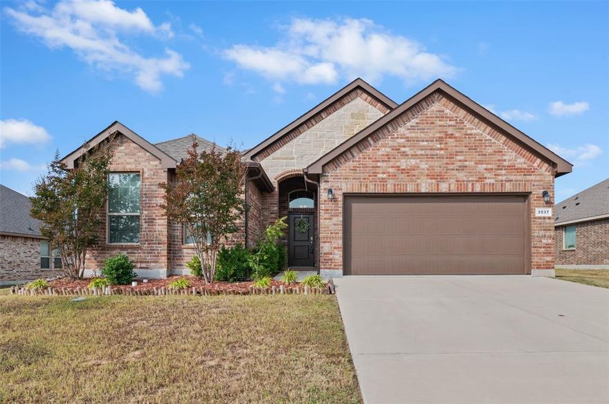 ASSUMABLE LOAN AVAILABLE AT 2.98%! Welcome to this beautiful 4-bedroom, 2-bathroom home offering 1,855 sq. ft. of comfortable living in a desirable Krum neighborhood. This modern brick home features an inviting open floor plan with a spacious living area that flows seamlessly into the kitchen and dining space, perfect for entertaining or gatherings.

The kitchen boasts granite countertops, stainless steel appliances, and a large island ideal for meal prep or casual dining. The primary suite provides a peaceful retreat with a walk-in closet and a private bathroom featuring dual sinks, a soaking tub, and a separate shower.

Enjoy forever views across the greenbelt with no front neighbors, just open skies and peaceful countryside.Enjoy evenings in the generous backyard, offering plenty of space for play or relaxation. With its great location near schools, shopping, and easy highway access, this home combines style, comfort, and convenience.