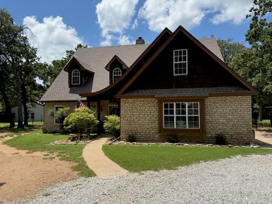 Come home to the tranquility of country living in your own little paradise- Gorgeous 3000+sqft, 2 story home, PLUS almost new 1000sqft guest home nestled on almost 10 acres, HUGE workshop with large office, Grandview ISD; The 4-2.5-2 primary residence has been updated with new roof 2023, both AC units replaced upstairs 2021 & downstairs 2024, new windows 2024, new gutters with leaf screens 2024, RO system, new flooring & trim downstairs 2025, garage with AC & epoxy floors. Granite counters, attractive & abundant cabinetry, 2 fireplaces, big bright windows throughout with breathtaking views of the heavily wooded surroundings. The 2nd residence is built with the same high standards & amenities as the main home & features 1 bedrm, 1.5 bath, even it's own rock FP, laundry rm, patio & pergola. Gigantic 32x48 workshop with wrap-around porch & multiple AC units, spray foam insulation, finished out office & half bath- 2 extra rooms with AC have been added & can either be finished or removed; Relax in the backyard oasis around the firepit, or float in the sparkling pool with beach area, fountains, & typhoon slide, all centrally located with views from both homes; Backyard has metal fencing for the dogs & 2 gazebos strategically placed among the common outdoor space; Plenty of room so bring the animals- abundant animal enclosures, fully fenced with shelter-barns, perfect for 4H or FFA projects; Inviting shaded paths have been cleared for walking, riding ATVs, or for animals to roam on this fully-fenced property; Additional 4-car carport as well; All situated behind pipe fencing and a solar-powered double front gate. Conveniently located near schools, shopping, & major highways. This rare find offers a beautiful mix of privacy and space, plus flexibility so pack your bags- Bring the family, animals, & all the toys-  Don't miss this unique opportunity to own it all! Refrigerator in main house and washer-dryer in both homes negotiable.  This is a steal so bring your buyers!