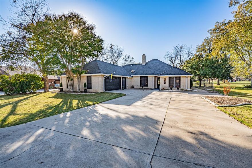 Step inside to this beautifully crafted classic bohemian style, completely renovated custom home located in the highly desirable gated Pecan Plantation community with 24hr security and abundant amenities. Featuring 3 beds, 2 baths, 2 living, dedicated office, and 3-car garage with golf cart area and sink. Every detail has been carefully considered combining those must-have upgrades with those unique custom touches throughout. The kitchen is a standout feature complete with a butler's pantry. Showcasing a large island and integrated hutch with butcher block countertop. A custom vent hood, pot filler, farm sink, and stainless-steel appliances including steam-clean oven and Bosch dishwasher. Designed for functionality and style this space provides exceptional storage and workspace perfect for cooking and entertaining. The primary suite boasts live edge Saman Butcher Block dual-sink vanity, custom walk-in shower, laundry chute, and a custom walk-in closet with built-ins for exceptional organization and storage. Additional highlights include a custom built-in desk and cabinetry in the office, wood-burning fireplace in living room, under-cabinet lighting in the guest bath, skylights, solar screens, stylish accent walls, and sliding barn doors that bring that character and charm. The family room offers a second wood-burning fireplace, custom cabinetry, decorative lighting, and built-in wine fridge. Enjoy the enclosed screened porch featuring a stylish privacy wall, TV insert, custom built-in with mini fridge, pull-down shades, and a screen door providing access to open patio and backyard overlooking hole 16. Additionally, the home offers a charming courtyard with a sliding door off family room. These inviting spaces are perfect for hosting gatherings, game nights, or simply unwinding. This home truly has it all! Thoughtful design, exceptional craftsmanship, and a community that offers every lifestyle amenity you could dream of. Your next chapter begins here...Welcome Home!