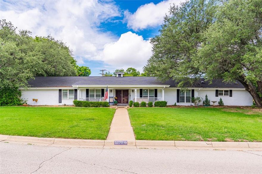 REDUCED PRICE! Where timeless charm meets modern comfort—this beautifully updated 5-bedroom home offers the best of both worlds. From the moment you arrive, the expansive covered front porch and classic brick entry invite you in, setting the tone for a home full of character and thoughtful upgrades. Inside, the front living room with plantation shutters opens to a private study—perfect for working from home or a quiet retreat. The heart of the home is the completely reimagined kitchen, featuring a massive island, double refrigerator, granite and butcher block countertops, and high-end appliances. A cozy brick fireplace anchors the spacious dining area, while a generous storage room keeps everything organized. The adjacent sunroom offers a stunning view of the mid-century style diving pool—your own private oasis. Designed for today’s lifestyle, this home has been updated with solar panels, modern plumbing and electrical systems, radiant barrier insulation, and energy-saving features that rival new construction. Ideal for multi-generational living or those who value space and flexibility, two of the five bedrooms include en-suite baths and are thoughtfully placed on opposite ends of the home. One of the Primary bedrooms currently utilized as family game room with gas fireplace for secondary gathering space.  Gorgeous wood, brick, and custom tile flooring throughout add warmth and timeless appeal. If you’ve been waiting for a home that blends history, personality, and modern livability—this is the one. Schedule your private showing today and experience the unmatched charm and comfort for yourself.