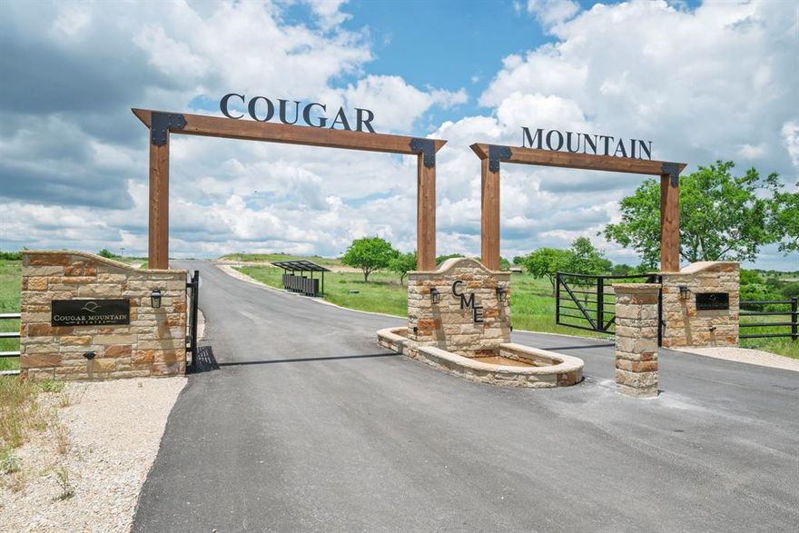 Welcome to luxury living in Cougar Mountain Estates! This premium 1.74-acre lot at the top of the hill offers breathtaking panoramic views and ultimate privacy. Located in a gated development with meticulously maintained asphalt roads. Families will benefit from the highly regarded Granbury ISD. Utilities include underground electric service by United Electric Co-op and high-speed internet from United Electric Fiber’s 1G fiber optic service. Water is supplied by private wells, and sewer services are managed with individual septic systems. This exceptional lot shares a border with the picturesque True Grit Ranch, providing incredible, unobstructed views of rolling hills and expansive ranchland. Enjoy quick access to 377 for convenient commuting. Residents also have exclusive access to a 6-acre private lake club on Lake Granbury, featuring a marina, sports courts, and other amenities. Don't miss this rare opportunity to build your dream home in Cougar Mountain Estates.