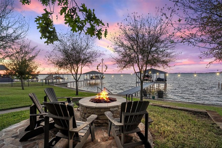 Live the lake life just southeast of Dallas at this charming open-water retreat on Cedar Creek Lake. Perfectly positioned for big water views and endless recreation, this beautifully maintained lakehouse offers the ideal blend of comfort, style, and outdoor living. The home features 4 bedrooms, 2 bathrooms, a 1-car garage, and a carport, as well as a bright, open-concept kitchen and living area with a fireplace—perfect for gathering after a day on the water. A separate den with a den - bar opens directly to the covered lakeside deck, creating an effortless indoor-outdoor flow for entertaining.
Step outside to enjoy a large lakeside backyard with room to relax, play, or expand your outdoor vision. The brand-new 2025 TREX boathouse offers low-maintenance durability and quick access to open water—ready for boating, sunsets, and lake days ahead. Pretty inside, inviting outside, and designed for lake living—this Cedar Creek Lake property is a rare find on open water.