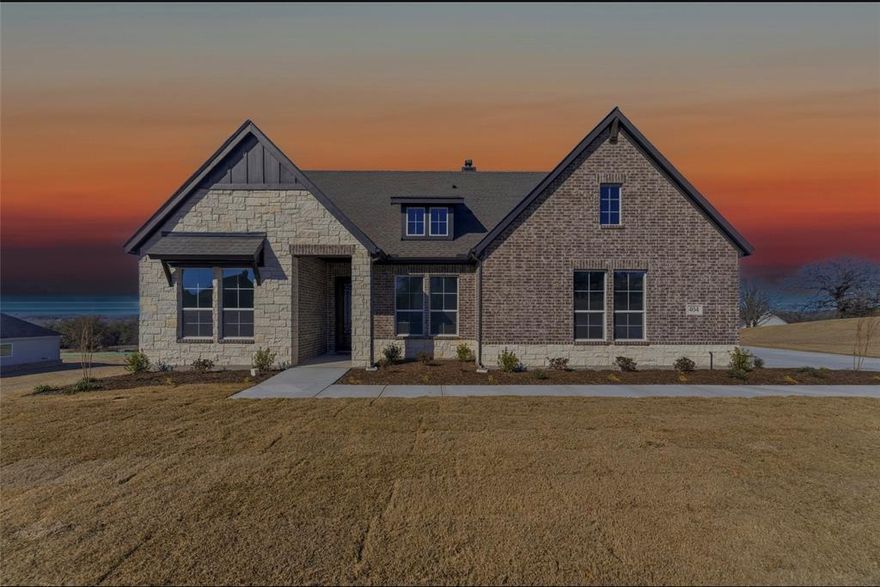 Estimated November 2025 completion! Ask us about our Trade In Trade Up program, we can buy your home! The Verbena floor plan features a modern, open-concept layout and the sought-after features today’s homeowners are searching for. With four bedrooms, three bathrooms, and a flex room, this plan boasts just over 2,400 square feet of functional living space. Upon entering the home off the front porch, you’re welcomed by an inviting foyer. Immediately to the left is a hallway with a bedroom, walk-in closet and full bathroom, as well as a linen closet. Across the foyer is a flex room, perfect for a home office, formal dining room or whatever need your family has for the space. Past the foyer is the family entry, with storage space and mud bench, which leads to the laundry room and two or three car attached garage. Through the entrance, the home opens up to a large family room with a stately fireplace. Adjacent to the family room is a gourmet kitchen, equipped with a walk-in pantry, ample counter space and an oversized island. Finishing off this open-concept living area is a dining space which overlooks the covered back patio. The remainder of this one-story floor plan is just off the living space. A hall leads to two bedrooms with walk-in closets, another linen closet and a shared full bathroom. The back corner of the home offers privacy for the owner’s suite, featuring a massive walk-in closet and bathroom with a dual-sink vanity, standalone soaking tub and glass-enclosed shower.