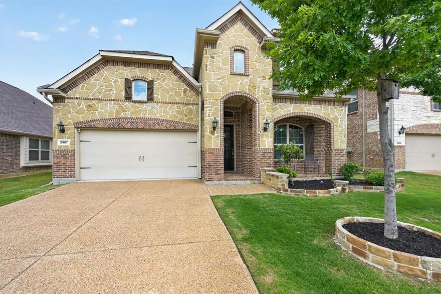 Immaculate sweet Family home well taken care of Updated and Upgraded as modern style contemporary kitchen with painted cabinets designer quartz countertop. Soothing combination of custom colors compliments the daylight entering the house through large windows in the central living area. Crown moldings white throughout. Elevation has natural stone reflects the impression of exterior character. LISD middle schools within walking distance. Centrally located and easy access to major freeways. This well-maintained property with such openness of this in Law suite floor plan featuring 2 bedrooms with 2 bedrooms downstairs, designated private study for professional to work remote jobs and spacious foyer with high ceiling. The main living area with fireplace, Backyard perfect for entertaining family and friends. Enjoy community pool, upstairs media and game room providing plenty of space for family and guests. The primary suite features a luxurious bath with garden tub, separate shower, and a spacious walk-in closet. Entertainment within minutes of drive to DFW airport, Grand Escape shopping, legacy west dining, hospitals. Residents enjoy morning and evening walks with your lovely pets and seating and play area for kids and toddlers, perfect for summer. All in one package deal. Don’t miss this opportunity. Pics coming soon.